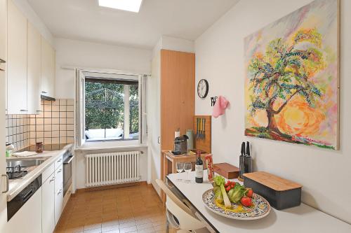 a kitchen with a plate of fruit on a counter at Ca' Lidia - Happy Rentals in Pregassona