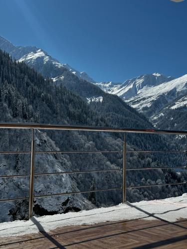 a balcony with a view of a mountain at Cafekush tosh in Tosh