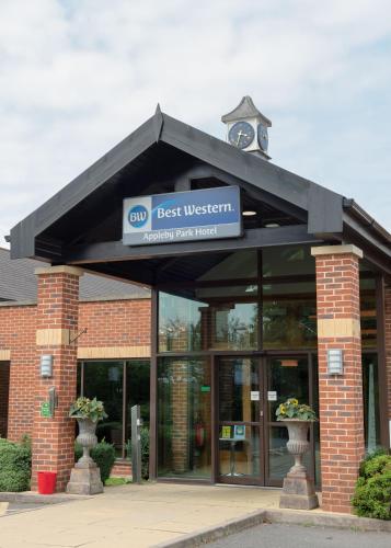 a best western building with a clock on top at Best Western Appleby Park Hotel in Tamworth