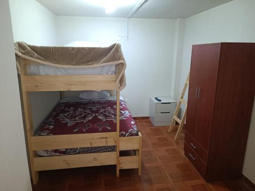 a small room with a bunk bed in it at Departamentos Cristo Rey 3 in Tacna
