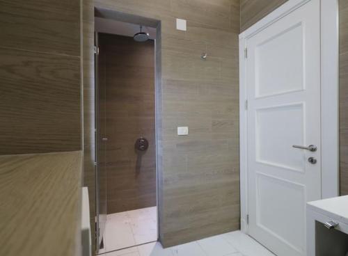 a shower with a glass door in a bathroom at Stylish modern studio in Budva with a sea view in Budva