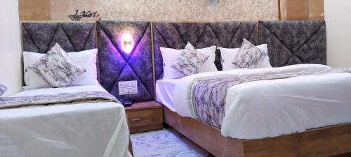 Postel nebo postele na pokoji v ubytování Hotel Primeland Villa Gota