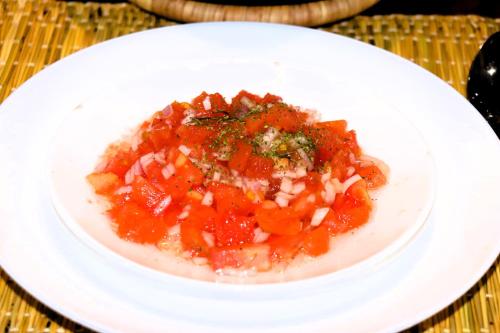 a white plate of food on a table at Riad ait Ben Haddou in Aït Ben Haddou