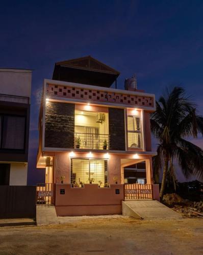 a house with lights on top of it at night at Holiday day home in Nandi skandagiri Hills in Nandi
