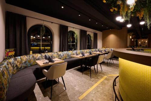a dining room with long tables and chairs at Boutique House happYellow Saalbach, inkl JokerCard in Saalbach Hinterglemm