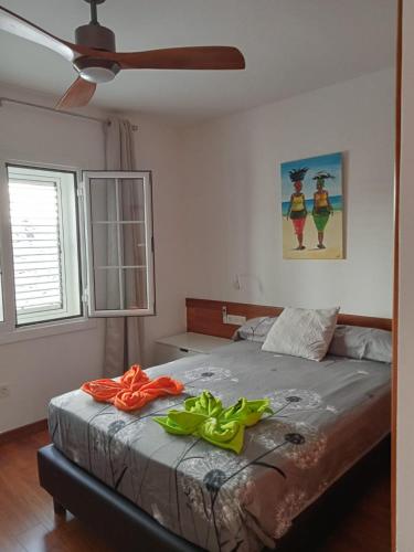 a bedroom with a bed with two towels on it at Villa Pol Lanzarote in Puerto Calero