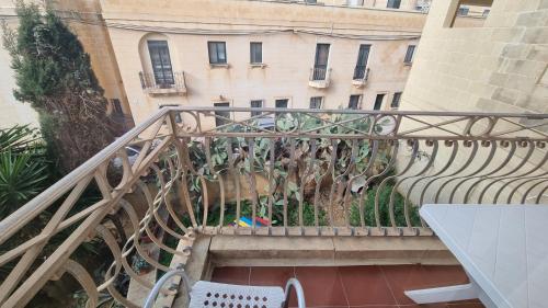 a staircase leading up to a building with a bench at Villa Serenity B&B in Sannat