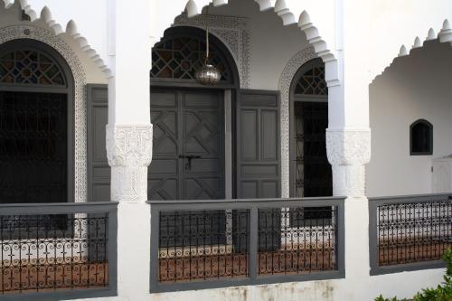 a house with a gate and a door at Riad Yamcha in Meknès