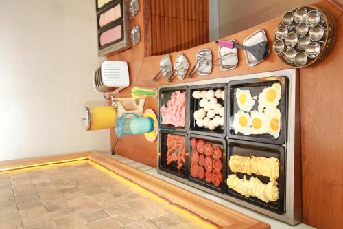 a room with many food items in a refrigerator at Maria Beach Hotel in Kissamos