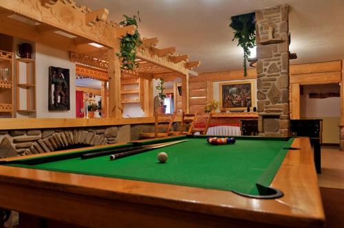 a billiard room with a pool table in a house at Willa Pod Orłem Jacuzzi Sauna in Kościelisko