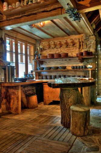 a room with a table and a table in a cabin at Willa Pod Orłem Jacuzzi Sauna in Kościelisko