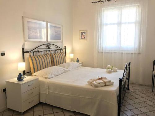 Posteľ alebo postele v izbe v ubytovaní Casa vacanze Borgo marinaro