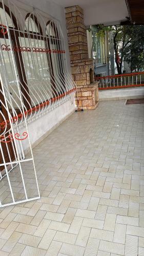 a tiled floor in front of a building at Black in Köseilyas