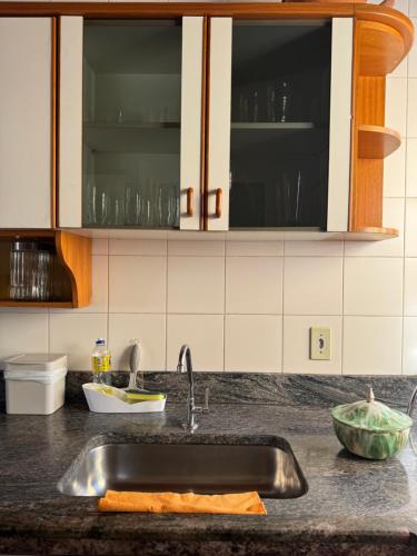 a kitchen with a sink and a counter top at Casa da Vó Loy in Araraquara