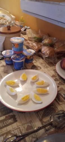 a white plate with eggs on it on a table at A casa di Anna in Vaglio Serra