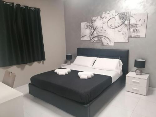 MY DREAM في كابو دورلاندو: غرفة نوم عليها سرير وفوط