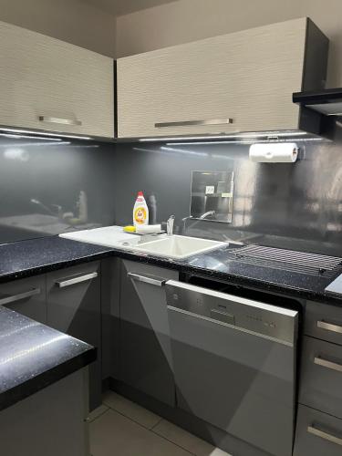 a kitchen with a sink and a counter at Chalupa na Lípové v Hlohovci in Hlohovec