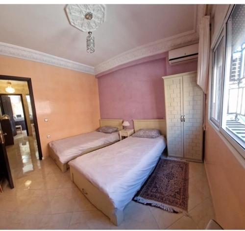 Postel nebo postele na pokoji v ubytování Aicha Appartement