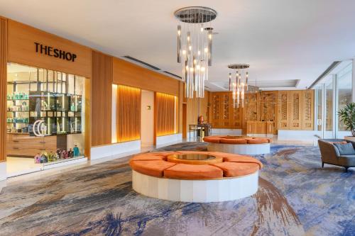 a store with two tables in the middle of a lobby at Royal Beach Eilat by Isrotel Exclusive in Eilat