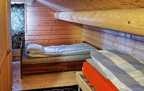 a room with two bunk beds in a log cabin at 4 Bedroom Pet Friendly Home In Tydal in Tydal