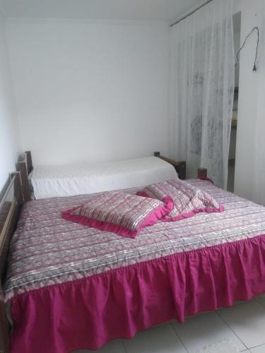 Кровать или кровати в номере Martim de Sá - 2 dormitórios
