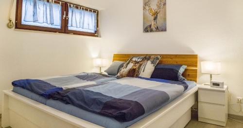 Ένα ή περισσότερα κρεβάτια σε δωμάτιο στο Ferienwohnung 109 Schwarzwald