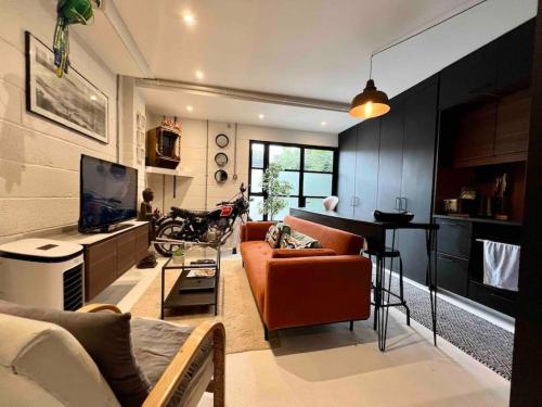 a living room with a couch and a table at Ground floor central apartment in Kingsbridge