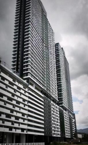 a tall building with many windows on the side of it at Urban Suites 3 Rooms, Cat Theme & Romantic in Jelutong