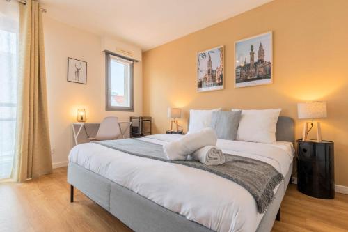 a bedroom with a large bed and a window at Lille Hypercentre equipped studio for 2 people! in Lille