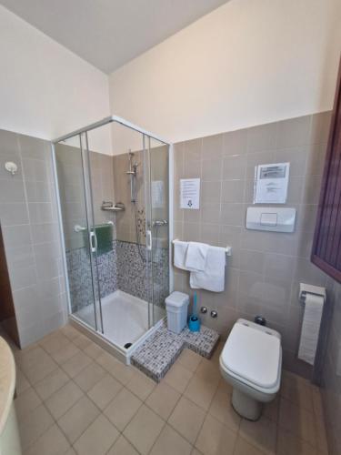 a bathroom with a shower and a toilet at casa vacanze sweet home in San Giovanni in Marignano