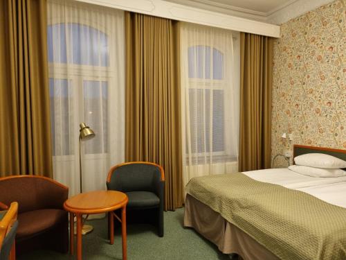 Postel nebo postele na pokoji v ubytování Hotel Lorensberg