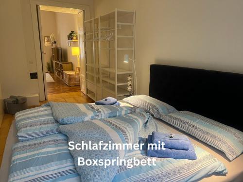 a bedroom with a bed with towels on it at Wohnen im Herzen von Graz in Graz