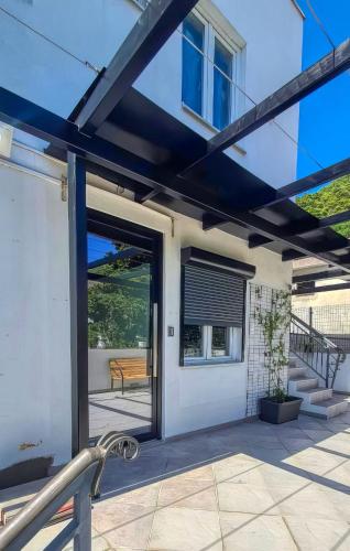 a glass door to a house with a patio at Apartmani Terminal in Budva