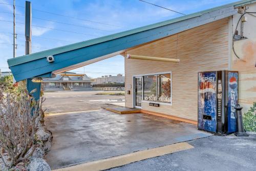an empty gas station with a blue roof at Blackfin Resort and Marina in Marathon