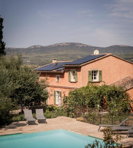 a house with a swimming pool in front of a house at Les Hauts de Diane, CUERS var in Cuers