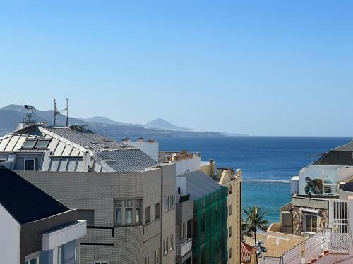 a view of the ocean from a building at Las Canteras con Alma in Las Palmas de Gran Canaria