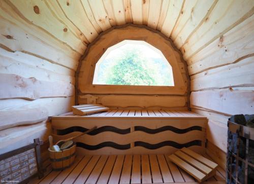 an inside view of a cabin with a window at Gasthof Pesbichl in Goldegg