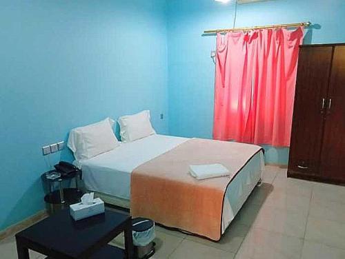 Cama o camas de una habitación en OYO Al Taj Rest House