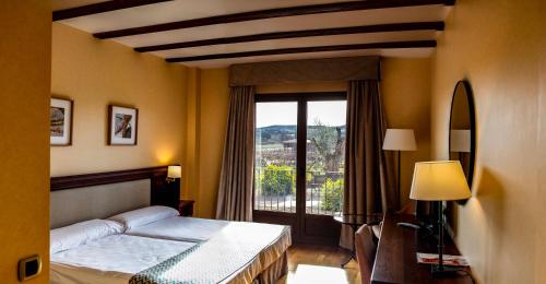 Postel nebo postele na pokoji v ubytování Hotel Spa Tudanca Aranda