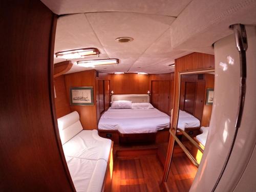 a small room with two beds on a boat at Yachtsail Alicia 20 meter in Olbia