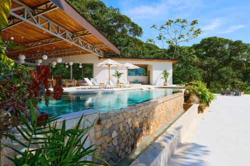 an image of a swimming pool in a house at Vista Celestial in Uvita