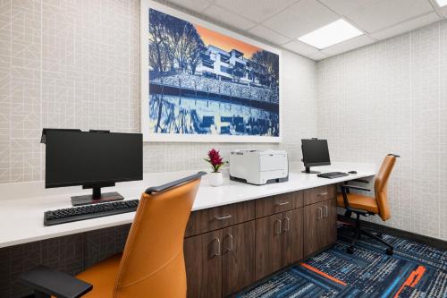 an office with a desk with a computer and two chairs at Hampton Inn Columbia, MD in Columbia