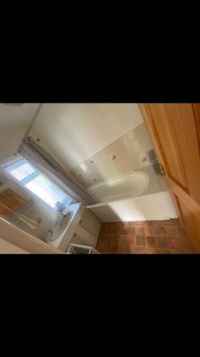 a view of a small bathroom with a window at 2 bed full house with private summer garden in Elswick