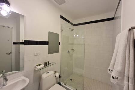 a bathroom with a shower and a toilet and a sink at Outstanding 1BR in Santa Ana in Panama City