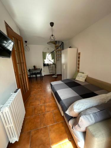a bedroom with a large bed in a room at Garden House Cit Turin in Turin