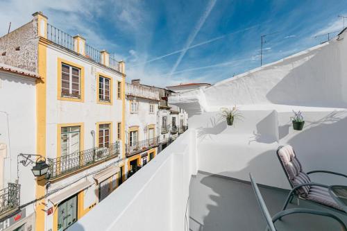 a view from the balcony of a building at Home near Évora's main square with private terrace in Évora
