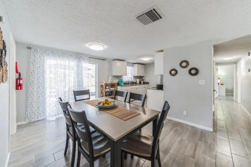 a dining room and kitchen with a table and chairs at Serenity Retreat- Charming Home Near Attractions! home in Brandon