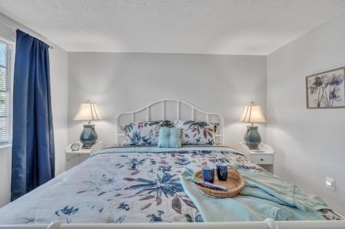 a bedroom with a bed with a basket and two lamps at Serenity Retreat- Charming Home Near Attractions! home in Brandon