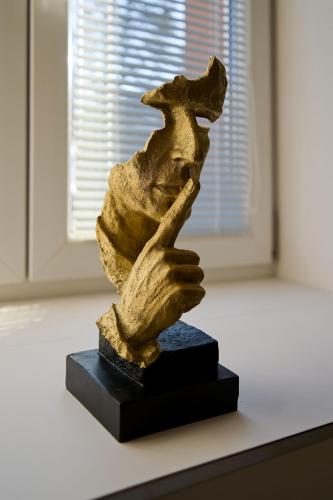 a statue sitting on top of a table at U Šípků in Ostrava