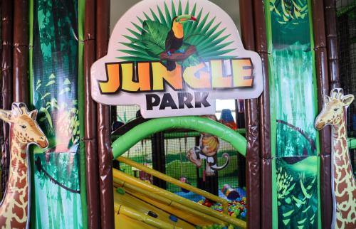 a sign for a jungle park with giraffes at Hotel Prestige Agadir Boutique & SPA in Agadir